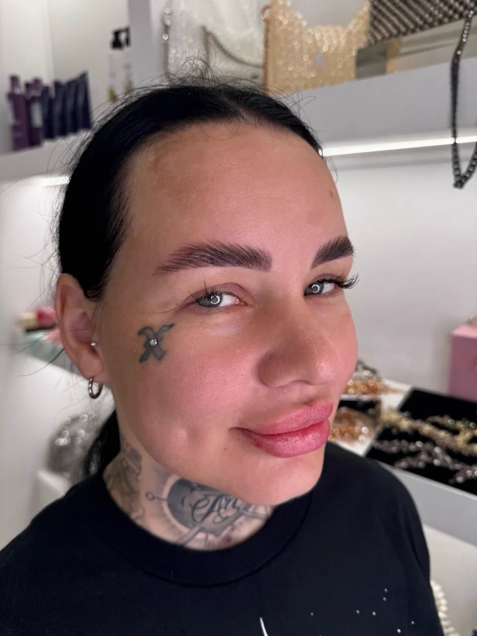 Client with laminated and tinted brows, photographed in the studio