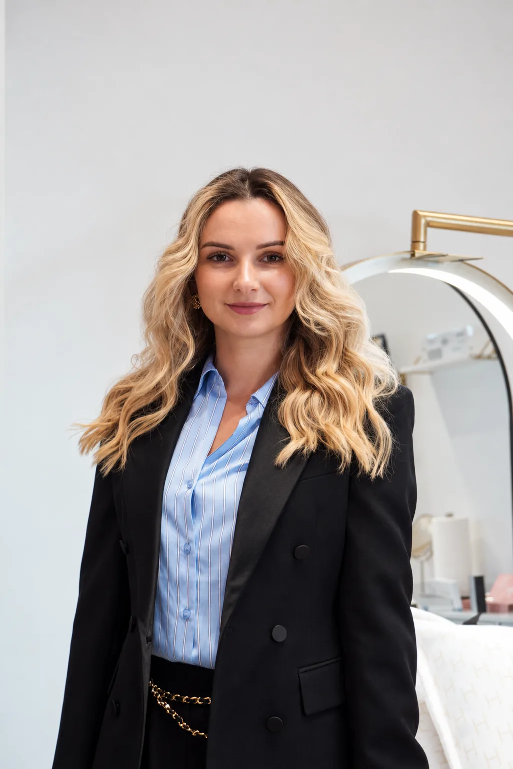 Halyna at the ring light during a brow appointment